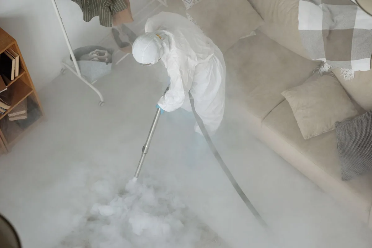 Biohazard cleanup technician in protective equipment, Kentwood, MI
